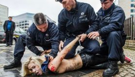 FEMEN protesters always quickly find themselves in this position.